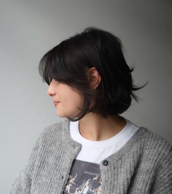 Textured shag bob with bangs at Ra'pôr Salon in Costa Mesa